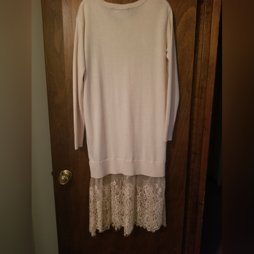 Forever 21 Offwhite sweater dress with lace bottom.